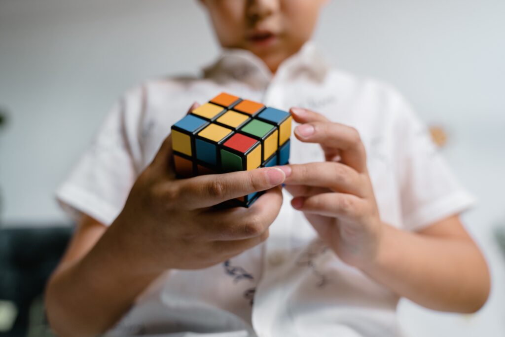 Child playing with Rubik's cube