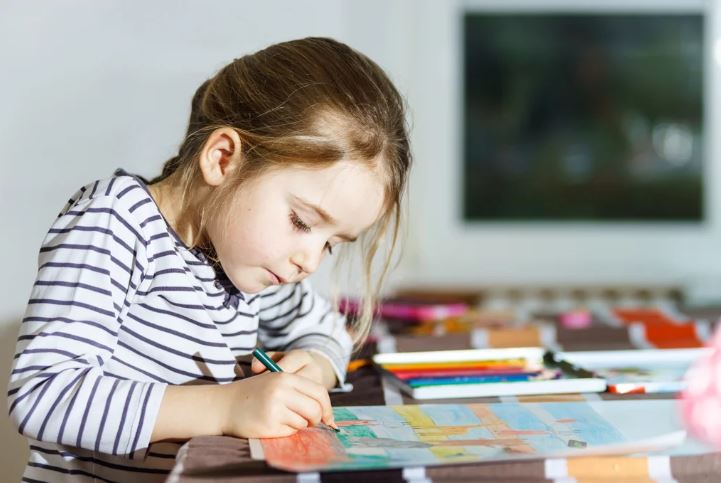 A child coloring a drawing